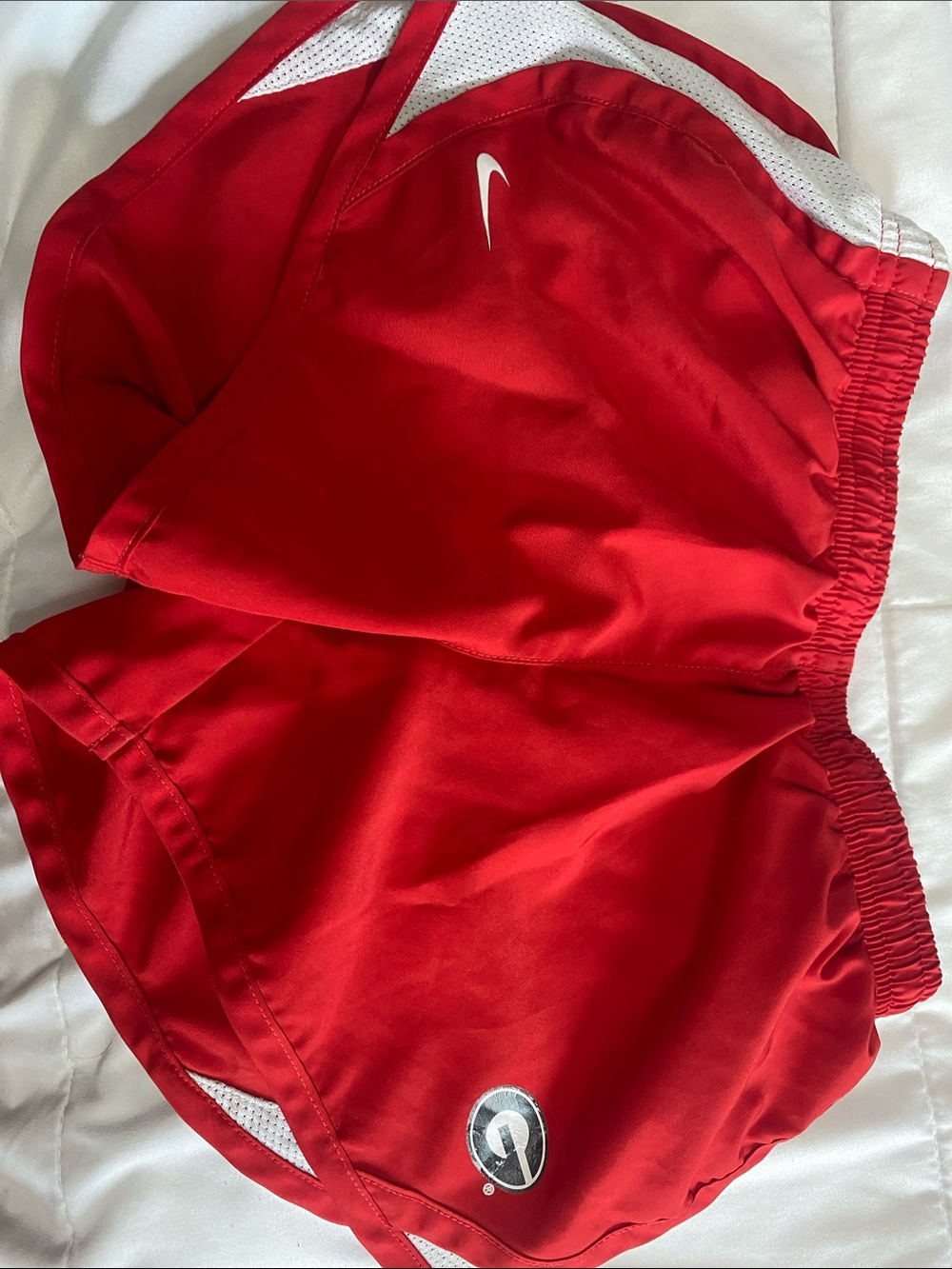 Nike Women’s Red Athletic Shorts with White Mesh Accents
